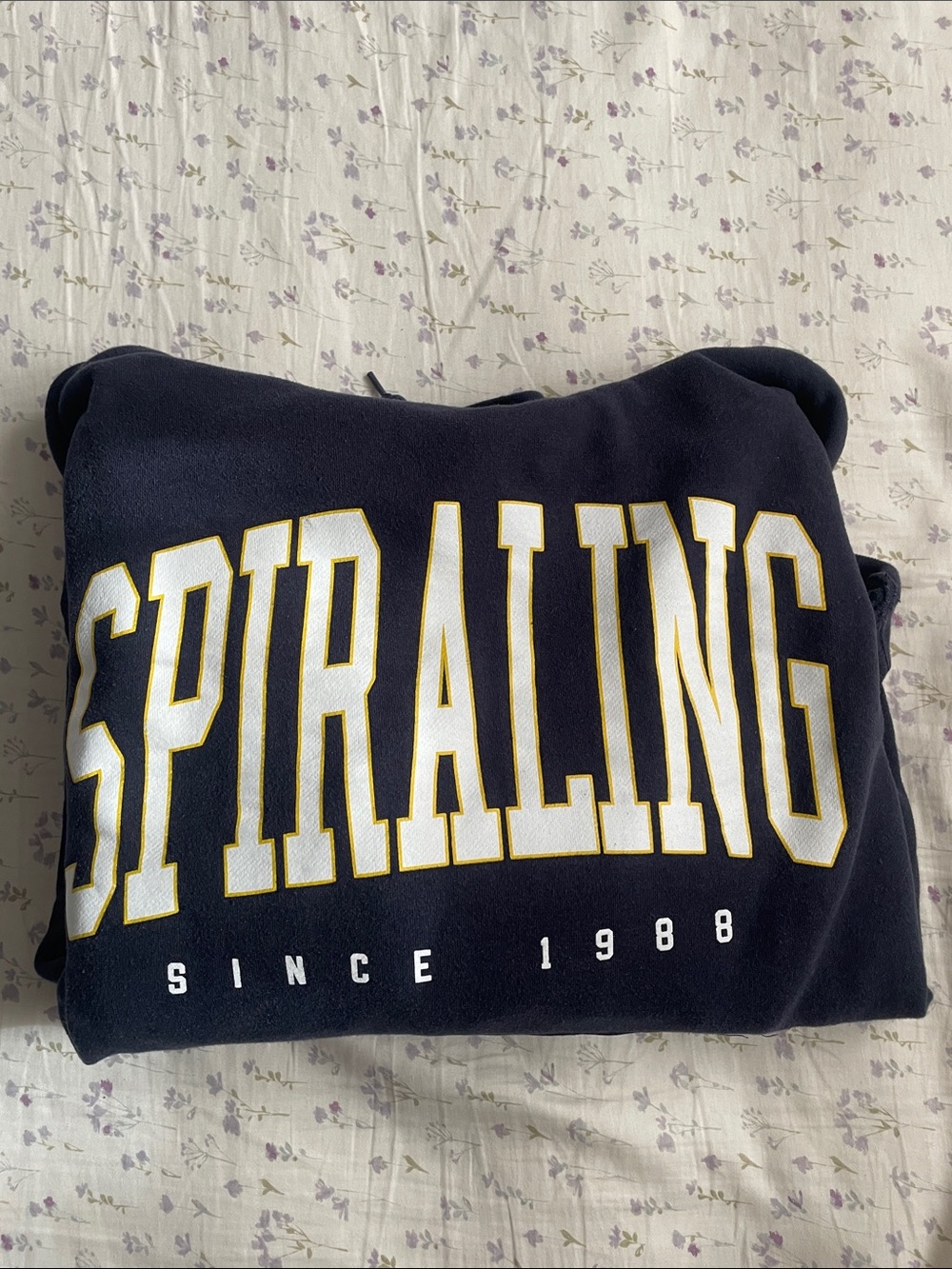 Spiraling Navy Sweatshirt with White & Gold Lettering